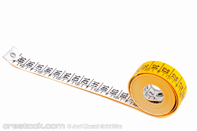 photo of a measuring tape a over white background