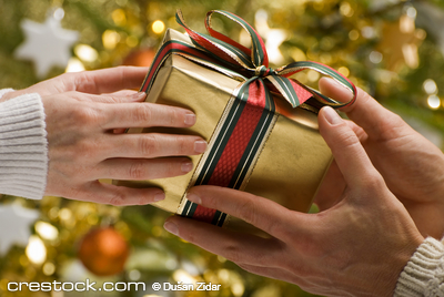 male giving a gift to female close up