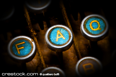 close up on old blue faq typewriter keys